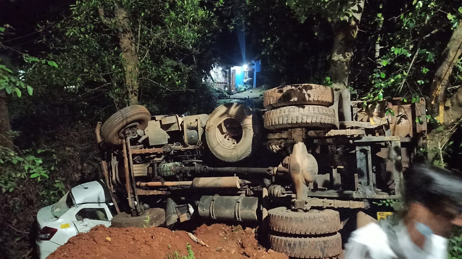 Taxi driver has lucky escape as truck overturns on car at Borim