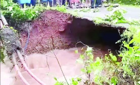 The road at Cotigao caves in, cuts-off half of the village